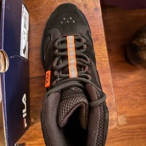 Woman’s Fila sneaker boots. Size 9.5 and NEVER worn,brand new